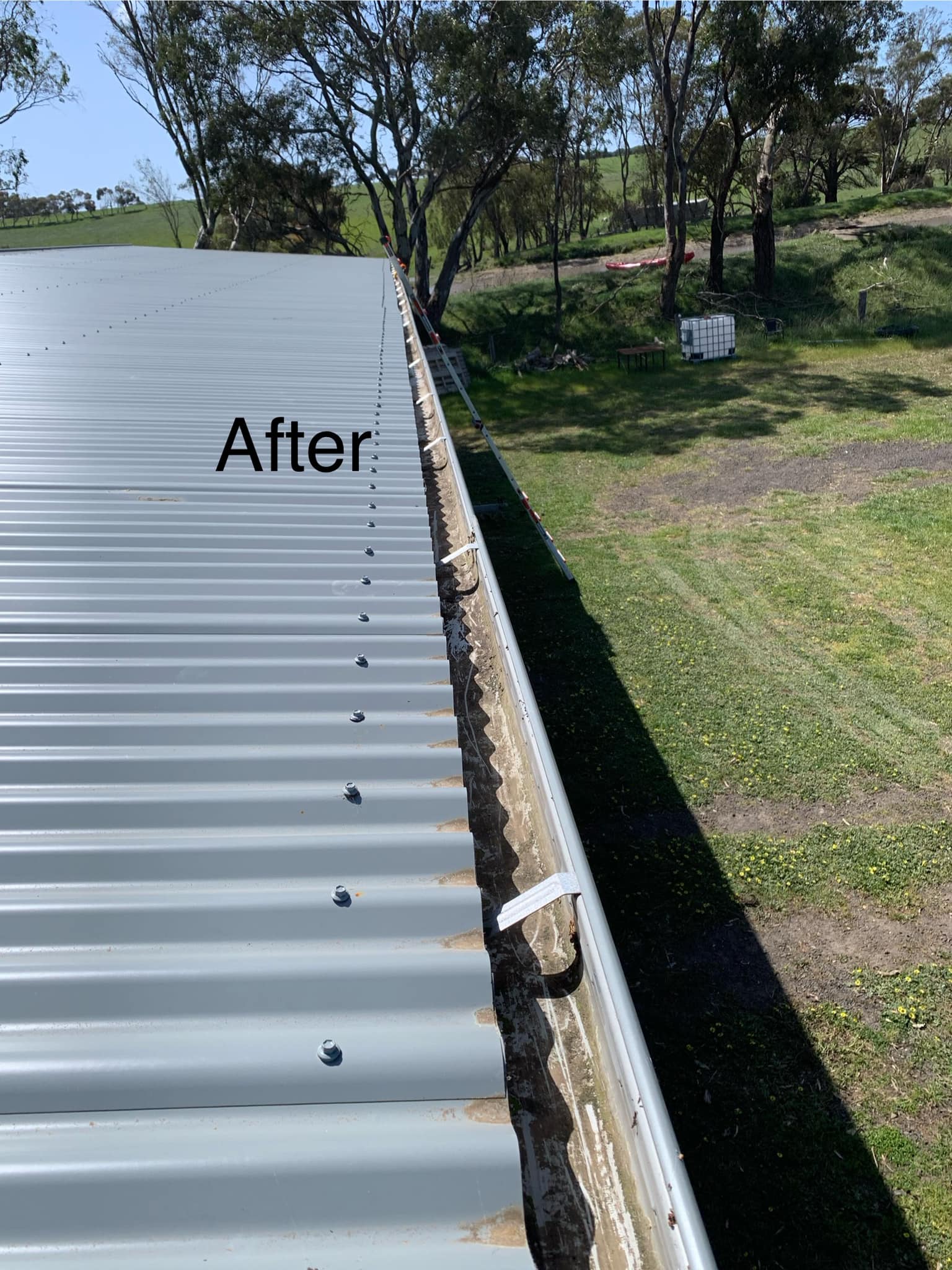 Hypercleaner team member cleaning a roof